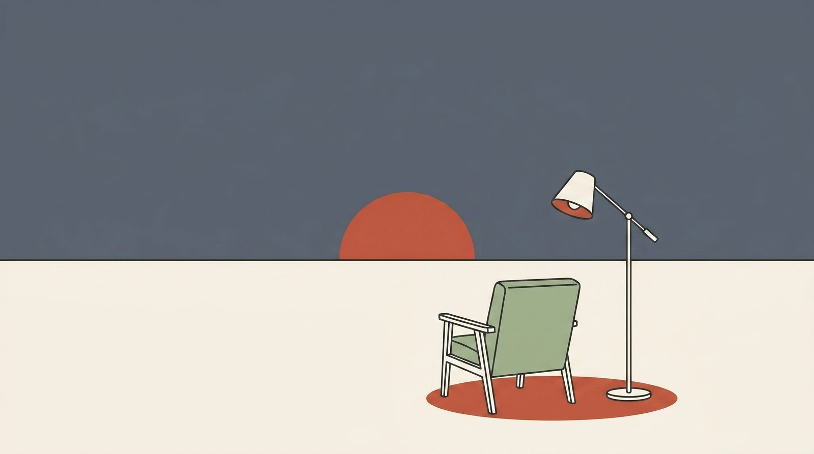 An armchair and lamp as the sun sets